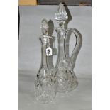 A 20TH CENTURY CLEAR CUT GLASS CLARET JUG AND A SIMILAR DECANTER, the claret jug with a facet cut