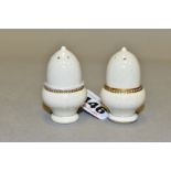 A PAIR OF MOORCROFT POTTERY MINIATURE PEPPERETTES OF ACORN FORM, cream glaze with gilt detail, bases