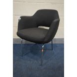 A 1970'S BLACK UPHOLSTERED DESK CHAIR, in the manner of Robin Day, on chrome legs