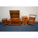 A QUANTITY OF YEW WOOD FURNITURE comprising a rectangular coffee table, bookcase, bedside cabinet,