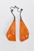 A PAIR OF NATURAL AMBER EARRINGS, the large drop earrings each of a tapered outline suspended from a