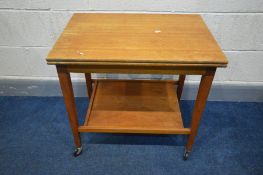 A MID 20TH CENTURY TEAK FOLD OVER CARD TABLE, lined with green baize, on square tapered legs, united