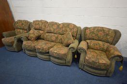 A GREEN AND FLORAL UPHOLSTERED THREE PIECE LOUNGE SUITE, comprising of a three seater sofa and two