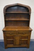 A MODERN OAK LINENFOLD DRESSER with two drawers and two doors, width 112cm x depth 49cm x height