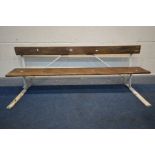 A CAST IRON AND PINE SLATTED SCHOOL BENCH, with a lift up seat, length 157cm (condition - some