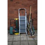 A COLLECTION OF GARDEN TOOLS AND ITEMS to include a rake, fork, spade, brushed, sack truck etc and a