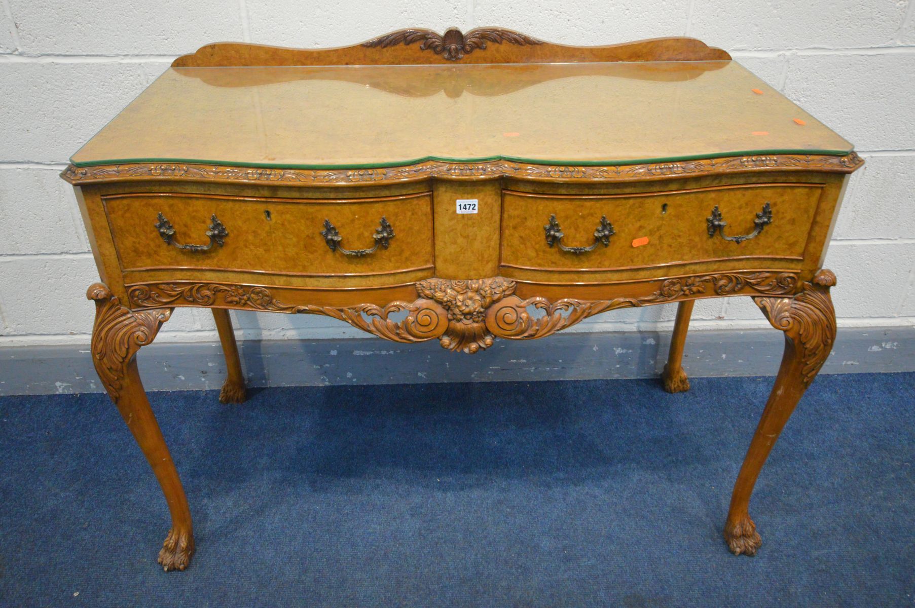 A REPRODUCTION VICTORIAN STYLE BURR WALNUT SERPENTINE SIDE TABLE, with a raised back, two frieze