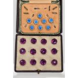 TWO CASED SETS OF DRESS STUDS, the first a set of six silver enamelled studs, each of a circular