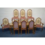 A REPRODUCTION VICTORIAN STYLE BURR WALNUT DINING TABLE, on cabriole legs and lions paw feet,