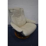 A STRESSLESS CREAM LEATHER RECLINING SWIVEL ARMCHAIR (missing one bolt)