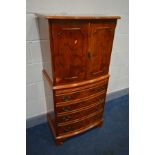 A YEW WOOD TWO DOOR DRINKS CABINET, with a brushing slide, width 62cm x depth 48cm x height 130cm (
