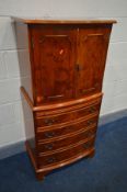 A YEW WOOD TWO DOOR DRINKS CABINET, with a brushing slide, width 62cm x depth 48cm x height 130cm (