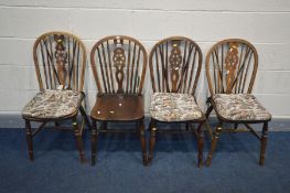 A SET OF FOUR OAK WHEELBACK CHAIRS