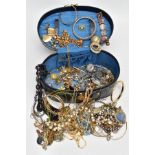 A JEWELLERY BOX WITH CONTENTS, a black oval jewellery box, with contents of costume jewellery to
