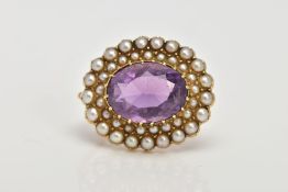 A LATE 19TH EARLY 20TH CENTURY AMETHYST AND SEED PEARL BROOCH, of an oval form, centring on an
