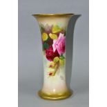 A ROYAL WORCESTER VASE OF CYLINDRICAL FORM PAINTED WITH ROSES, flared gilt rims, ivory ground, shape