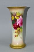 A ROYAL WORCESTER VASE OF CYLINDRICAL FORM PAINTED WITH ROSES, flared gilt rims, ivory ground, shape