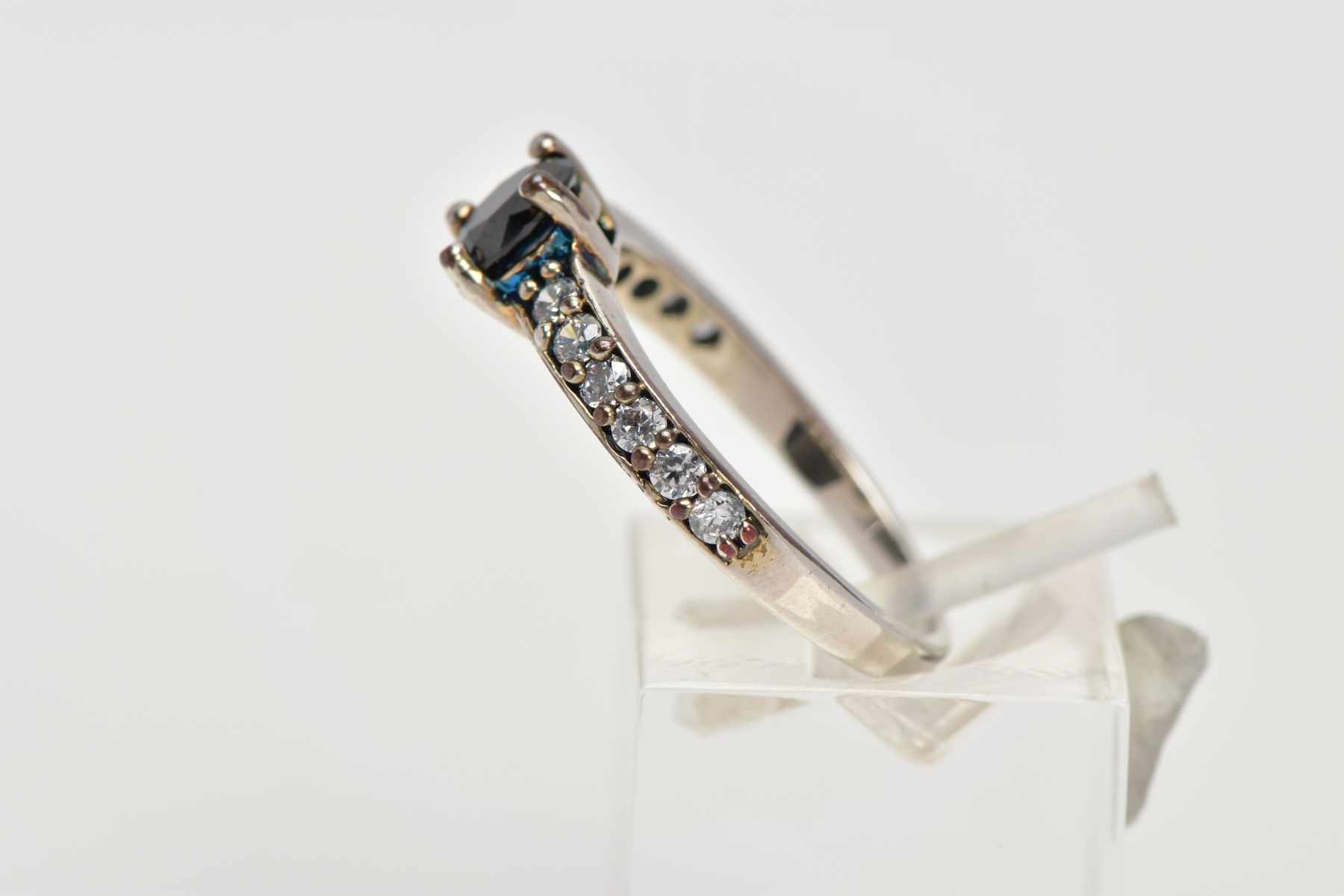 A WHITE METAL CUBIC ZIRCONIA DRESS RING, designed with a central circular cut black stone assessed - Image 2 of 4