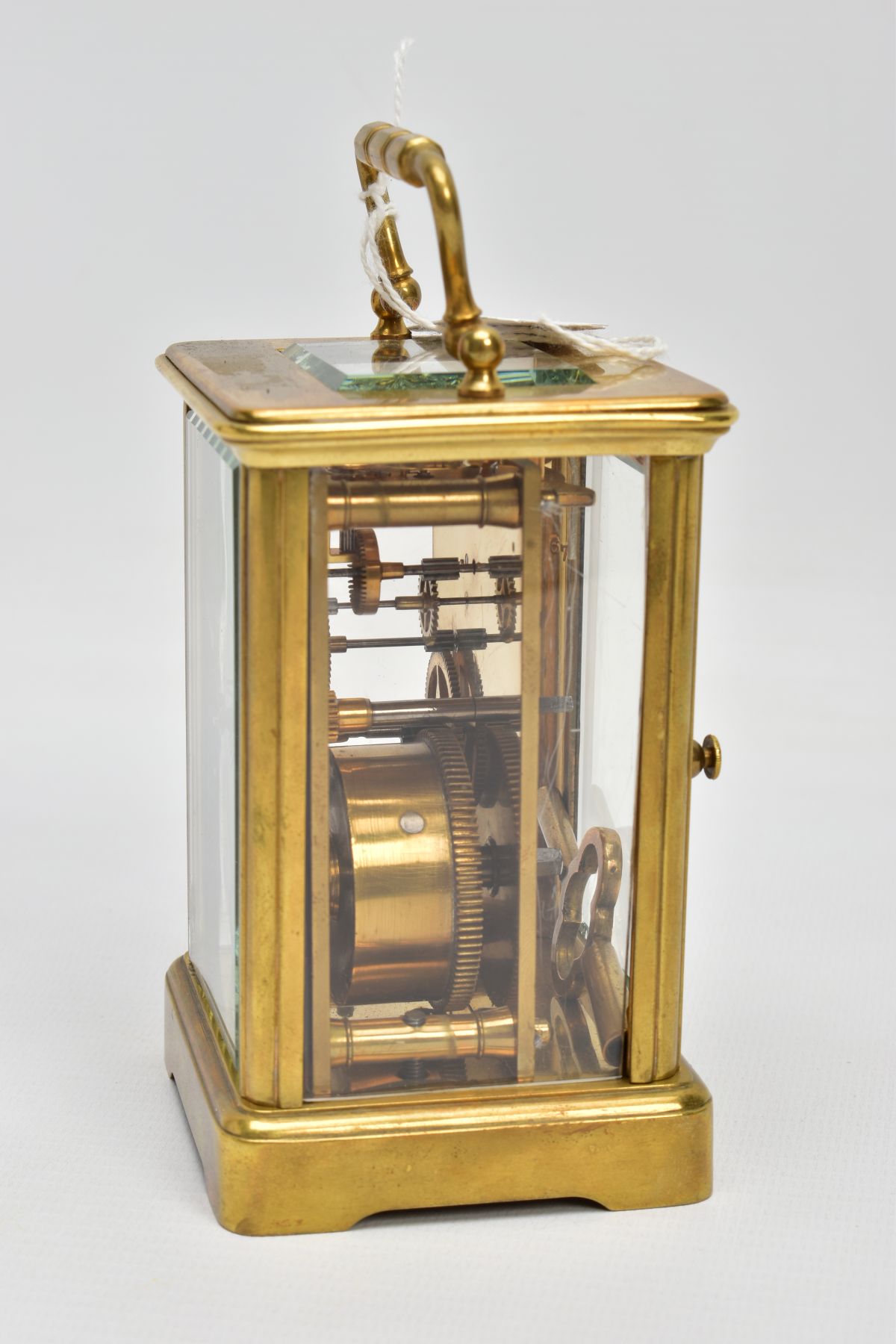 A BRASS CARRIAGE CLOCK, white dial, Roman numerals, blue hands, within a five glass panel - Image 3 of 6