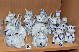 ELEVEN FRANKLIN MINT 'COUNTRY FRIENDS BY HALLIE GREEN' BLUE AND WHITE PORCELAIN JUGS OF ANIMAL FORM,