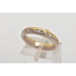 A FULL DIAMOND ETERNITY RING, the band designed with half yellow and half white colour metal, set