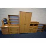 A LARGE QUANTITY OF PINE EFFECT BEDROOM FURNITURE, to include a double door wardrobe, two single