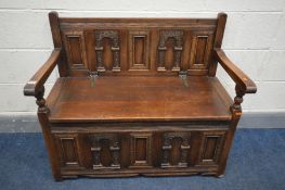 AN OLD CHARM CARVED OAK MONKS BENCH, width 99cm x depth 50cm x height 84cm