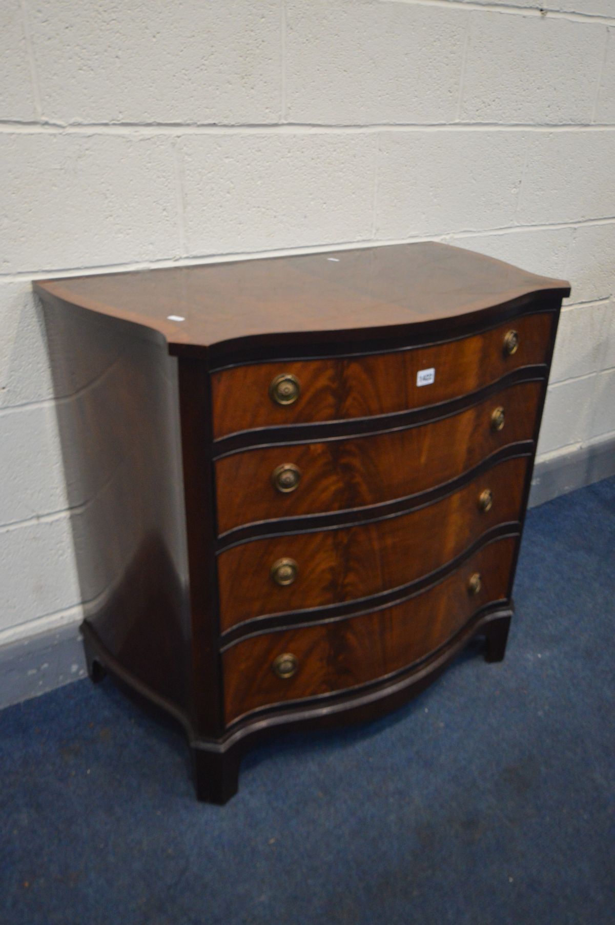 A REPRODUCTION MAHOGANY AND CROSSBANDED SERPENTINE CHEST OF FOUR LONG GRADUATED DRAWERS, on - Image 2 of 2