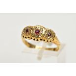 A 1930'S 18CT GOLD GARNET AND DIAMOND RING, designed as three graduated circular garnets within