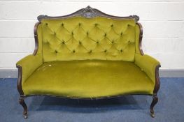 A 20TH CENTURY FRENCH TWO SEATER SOFA, carved top rail to downward swept arms, buttoned back and