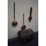 A DISTRESSED VICTORIAN CANVAS AND LEATHER DOMED TRAVELLING TRUNK, along with two copper bed