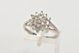 A 9CT WHITE GOLD DIAMOND CLUSTER RING, cluster designed with claw set, round brilliant cut diamonds,