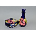 A MOORCROFT POTTERY POWDER BOWL AND COVER AND A BULBOUS SHAPED VASE, both in Hibiscus pattern on a