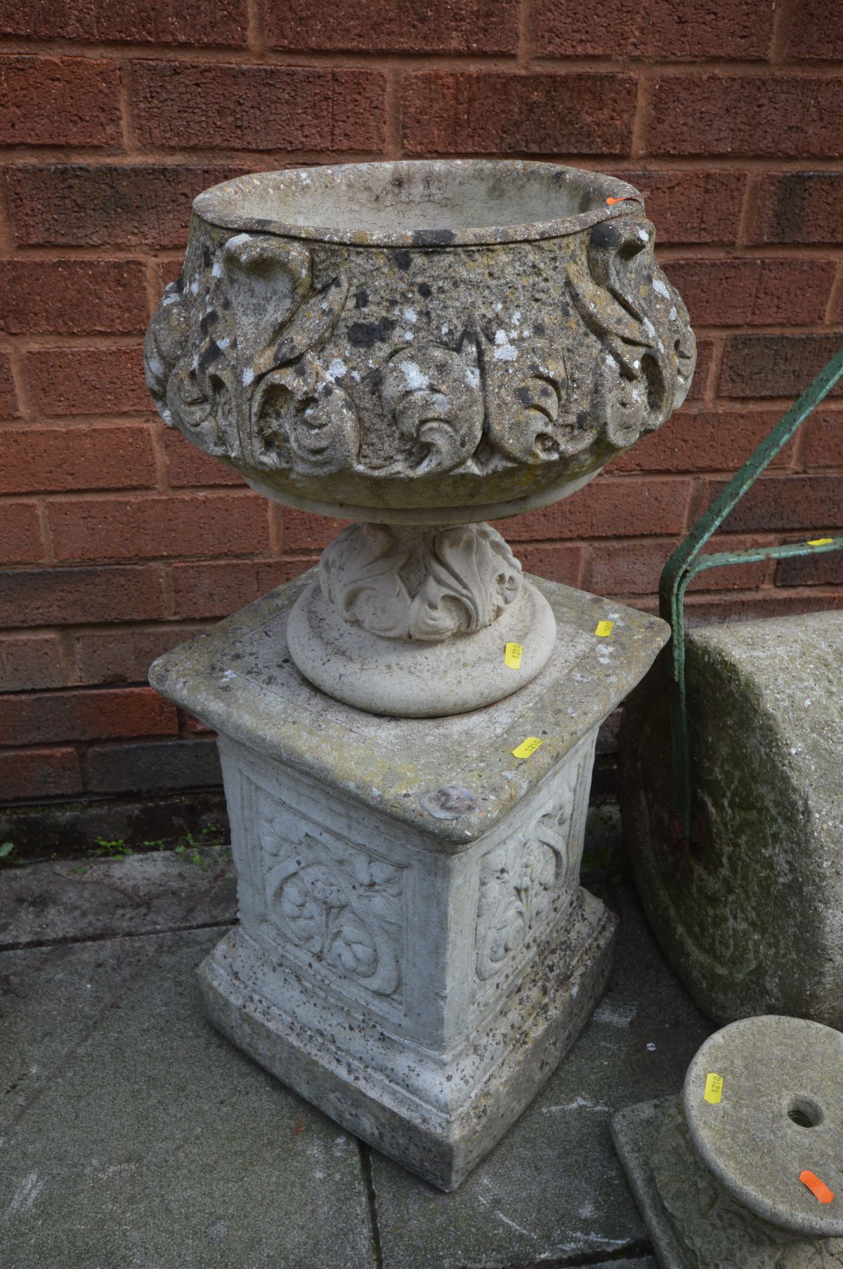 A VINTAGE METAL FRAMED COMPOSITE GARDEN ROLLER, a composite urn with fleur de lis detailing on a - Image 2 of 3