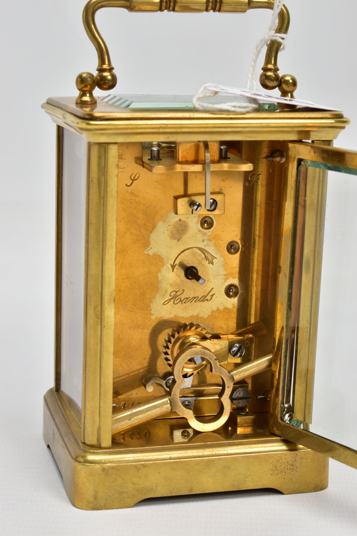 A BRASS CARRIAGE CLOCK, white dial, Roman numerals, blue hands, within a five glass panel - Image 5 of 6