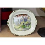 A ROYAL CROWN DERBY TWIN HANDLED SANDWICH PLATE WITH A HANDPAINTED SCENE OF HADDON HALL BY W.E.J