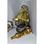 A VICTORIAN BRASS FIREMANS HELMET IN THE MERRYWEATHER PATTERN, crossed axes and flaming torch
