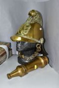 A VICTORIAN BRASS FIREMANS HELMET IN THE MERRYWEATHER PATTERN, crossed axes and flaming torch