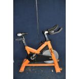 AN ELITE-FITNESS SPIN BIKE (one end cap on base missing)