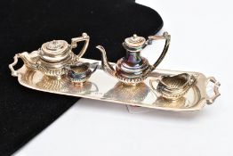 A MINIATURE FOUR PIECE TEA SERVICE SET WITH TRAY, comprising of a coffee pot and teapot both with