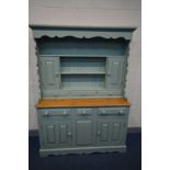 A PARTIALLY GREEN PAINTED PINE DRESSER, the top with two cupboard doors above three drawers, the