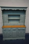 A PARTIALLY GREEN PAINTED PINE DRESSER, the top with two cupboard doors above three drawers, the