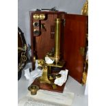 A VICTORIAN ELLIOT BROTHERS OF LONDON GILT BRASS MICROSCOPE, together with accessories and