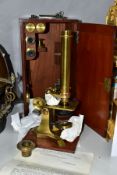 A VICTORIAN ELLIOT BROTHERS OF LONDON GILT BRASS MICROSCOPE, together with accessories and