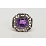 A LATE VICTORIAN AMETHYST AND ROSE CUT DIAMOND BROOCH, centring on a cushion cut amethyst, within an