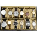 A HINGED LEATHER WATCH CASE CONTAINING TWELVE GENTLEMEN'S WRISTWATCHES, to include Accurist,