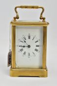 A BRASS CARRIAGE CLOCK, white dial, Roman numerals, blue hands, within a five glass panel