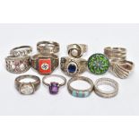 A BAG OF ASSORTED WHITE METAL RINGS, thirteen rings in total, some set with paste or semi-precious
