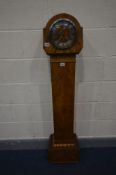 AN ART DECO WALNUT CASED GRAND DAUGHTER CLOCK, with a silvered dial and roman numerals, height 140cm