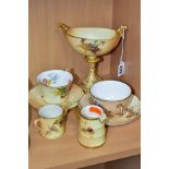 SEVEN PIECES OF ROYAL WORCESTER BLUSH IVORY ITEMS, all pieces printed and tinted with floral sprays,
